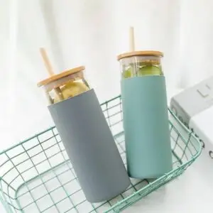 Glass bottle with bamboo straw